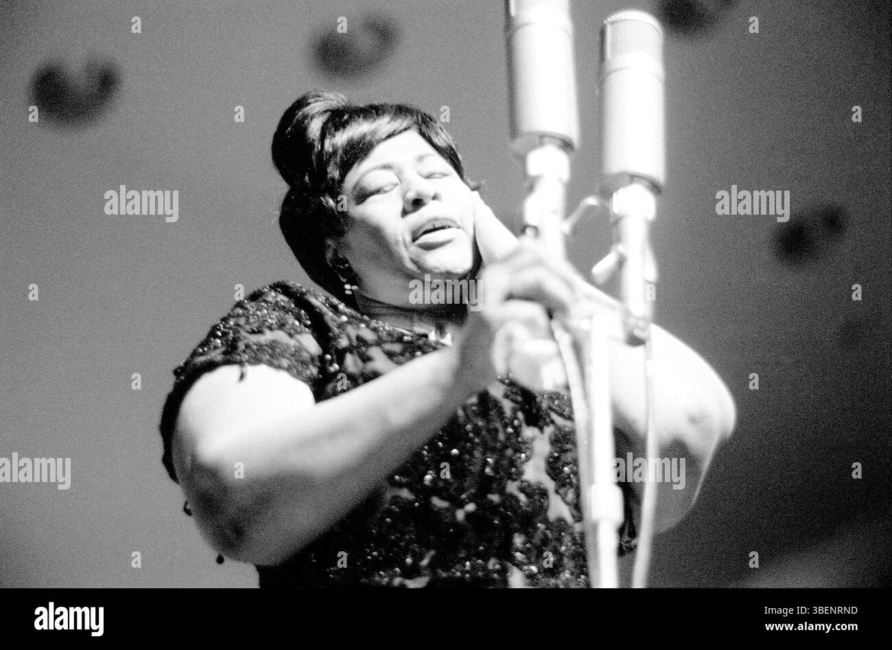 Fitzgerald performing at the Helsinki Culture Hall in Finland in April 1963. Ella Jane Fitzgerald (April 25, 1917 – June 15, 1996) was an American singer, songwriter and composer, sometimes referred to as the "First Lady of Song", "Queen of Jazz", and "Lady Ella". She was noted for her purity of tone, impeccable diction, phrasing, timing, intonation, absolute pitch, and a "horn-like" improvisational ability. Stock Photo
