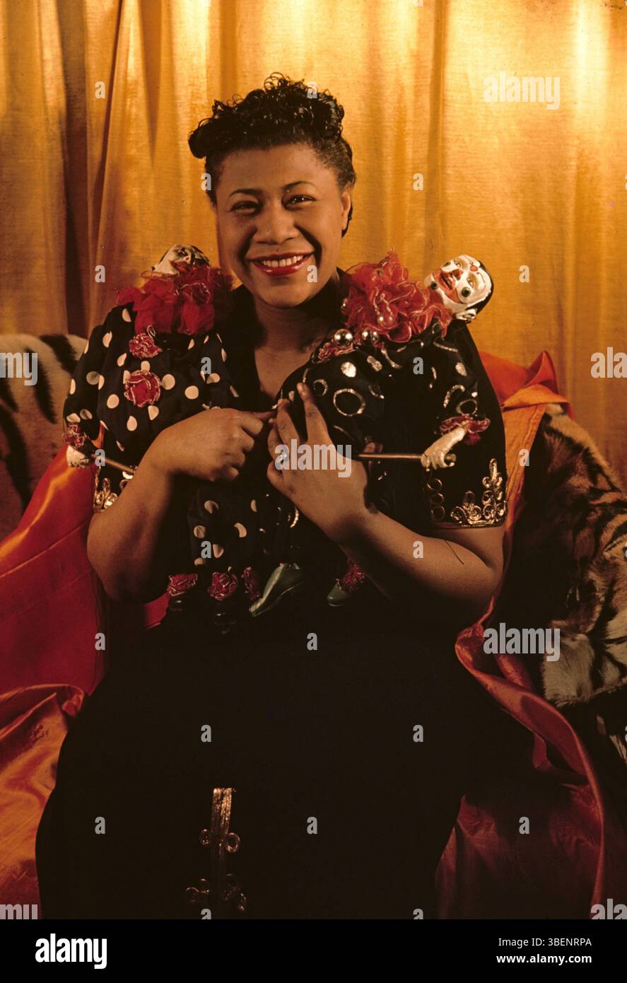 Kodachrome photo of Ella Fitzgerald taken by Carl Van Vechten. Ella Jane Fitzgerald (April 25, 1917 – June 15, 1996) was an American singer, songwriter and composer, sometimes referred to as the "First Lady of Song", "Queen of Jazz", and "Lady Ella". She was noted for her purity of tone, impeccable diction, phrasing, timing, intonation, absolute pitch, and a "horn-like" improvisational ability. Stock Photo