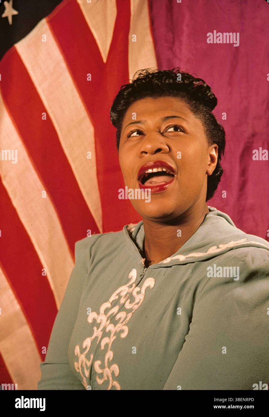 Kodachrome photo of Ella Fitzgerald taken by Carl Van Vechten. Ella Jane Fitzgerald (April 25, 1917 – June 15, 1996) was an American singer, songwriter and composer, sometimes referred to as the "First Lady of Song", "Queen of Jazz", and "Lady Ella". She was noted for her purity of tone, impeccable diction, phrasing, timing, intonation, absolute pitch, and a "horn-like" improvisational ability. Stock Photo