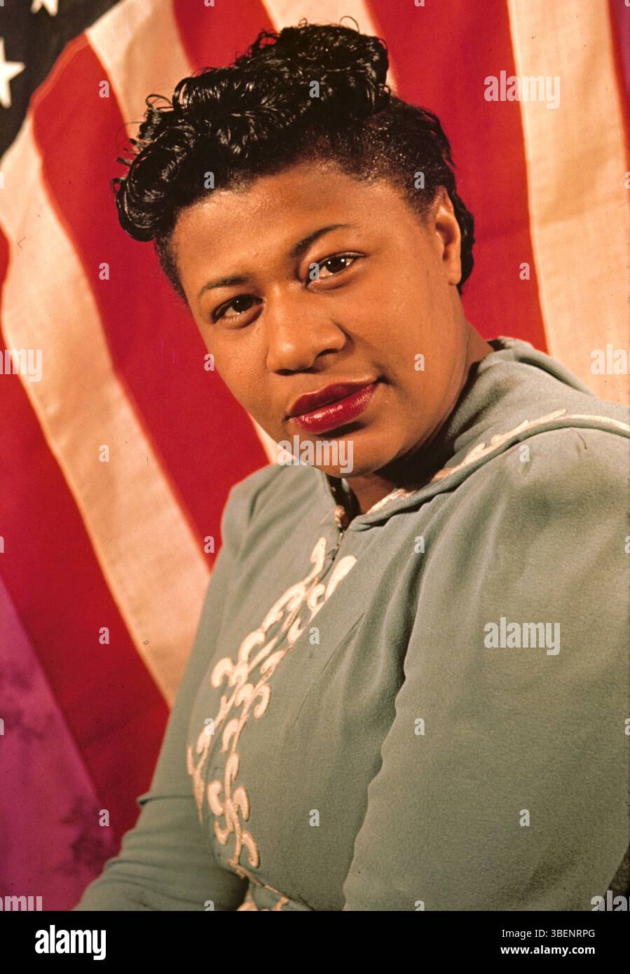 Kodachrome photo of Ella Fitzgerald taken by Carl Van Vechten. Ella Jane Fitzgerald (April 25, 1917 – June 15, 1996) was an American singer, songwriter and composer, sometimes referred to as the "First Lady of Song", "Queen of Jazz", and "Lady Ella". She was noted for her purity of tone, impeccable diction, phrasing, timing, intonation, absolute pitch, and a "horn-like" improvisational ability. Stock Photo