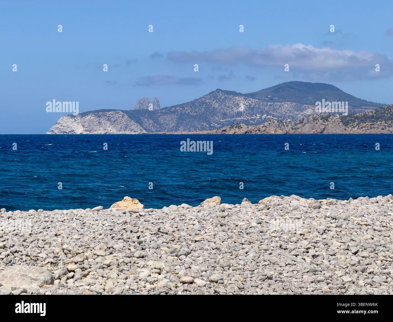 Remote coastal track Camino Cap des Falcó, with dramatic sky and rugged landscape, Ibiza, Balearic Islands, Spain - Smartphone Captured Stock Image