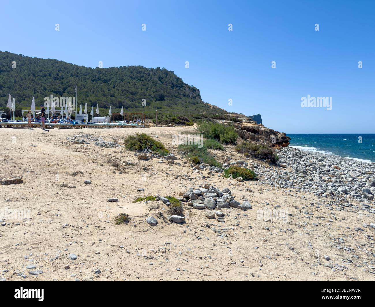 Remote coastal track Camino Cap des Falcó, with dramatic sky and rugged landscape, Ibiza, Balearic Islands, Spain - Smartphone Captured Stock Image
