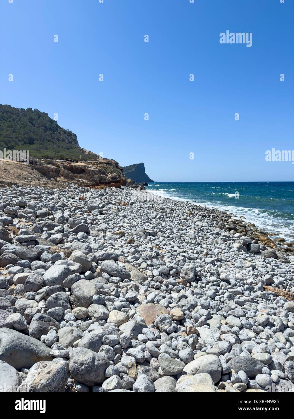 Remote coastal track Camino Cap des Falcó, with dramatic sky and rugged landscape, Ibiza, Balearic Islands, Spain - Smartphone Captured Stock Image
