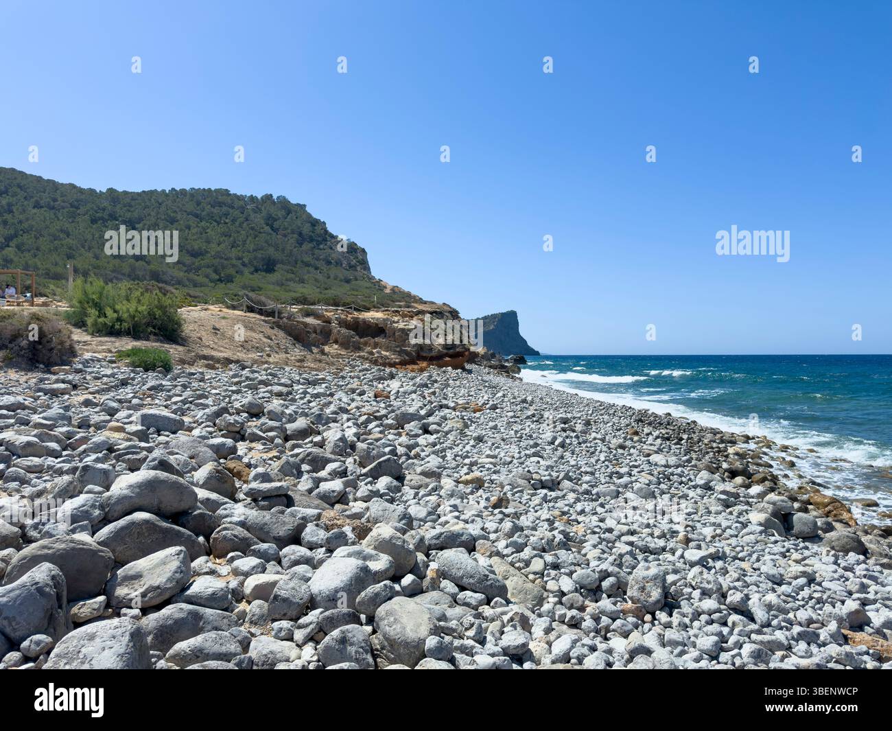 Remote coastal track Camino Cap des Falcó, with dramatic sky and rugged landscape, Ibiza, Balearic Islands, Spain - Smartphone Captured Stock Image