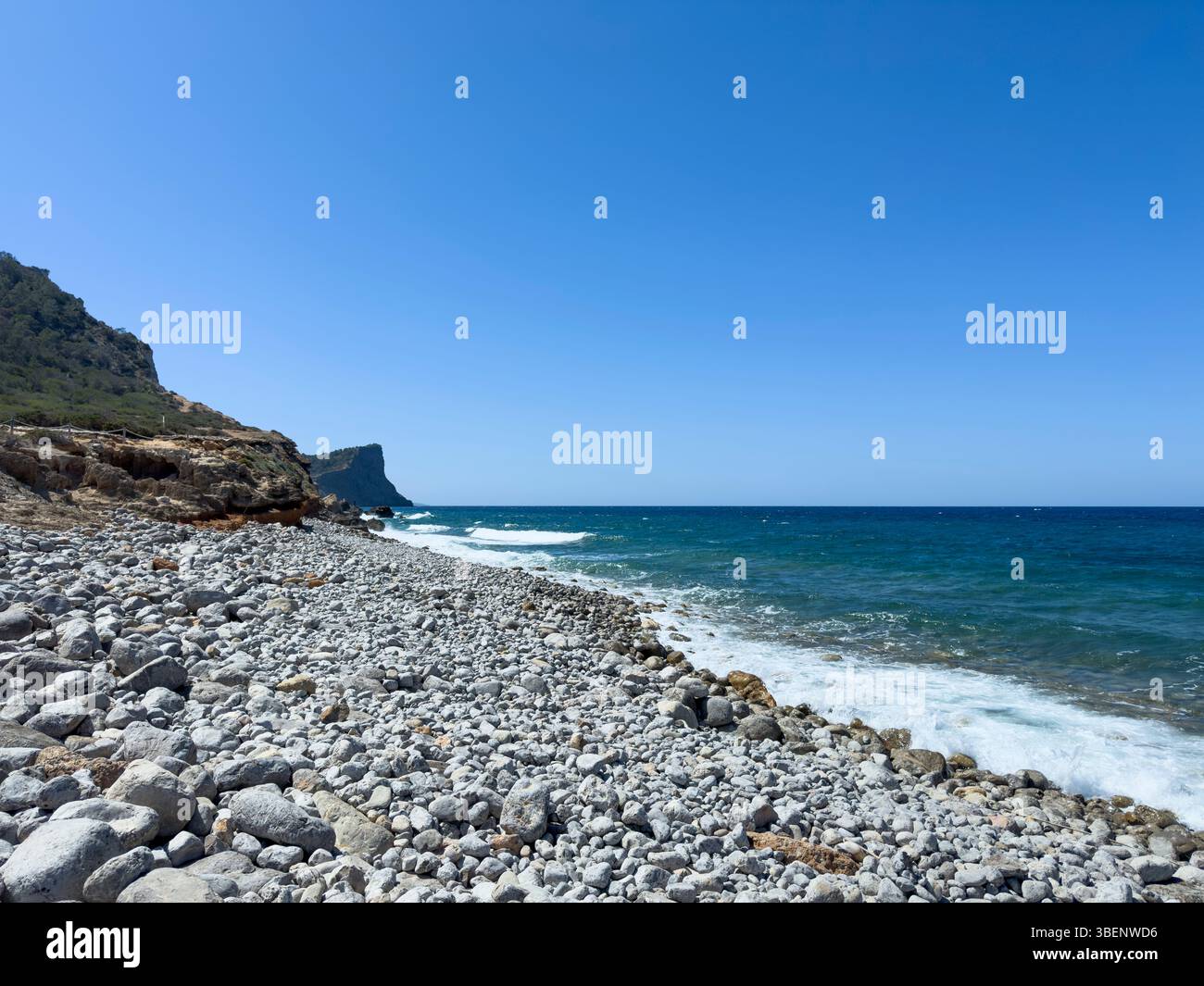 Remote coastal track Camino Cap des Falcó, with dramatic sky and rugged landscape, Ibiza, Balearic Islands, Spain - Smartphone Captured Stock Image