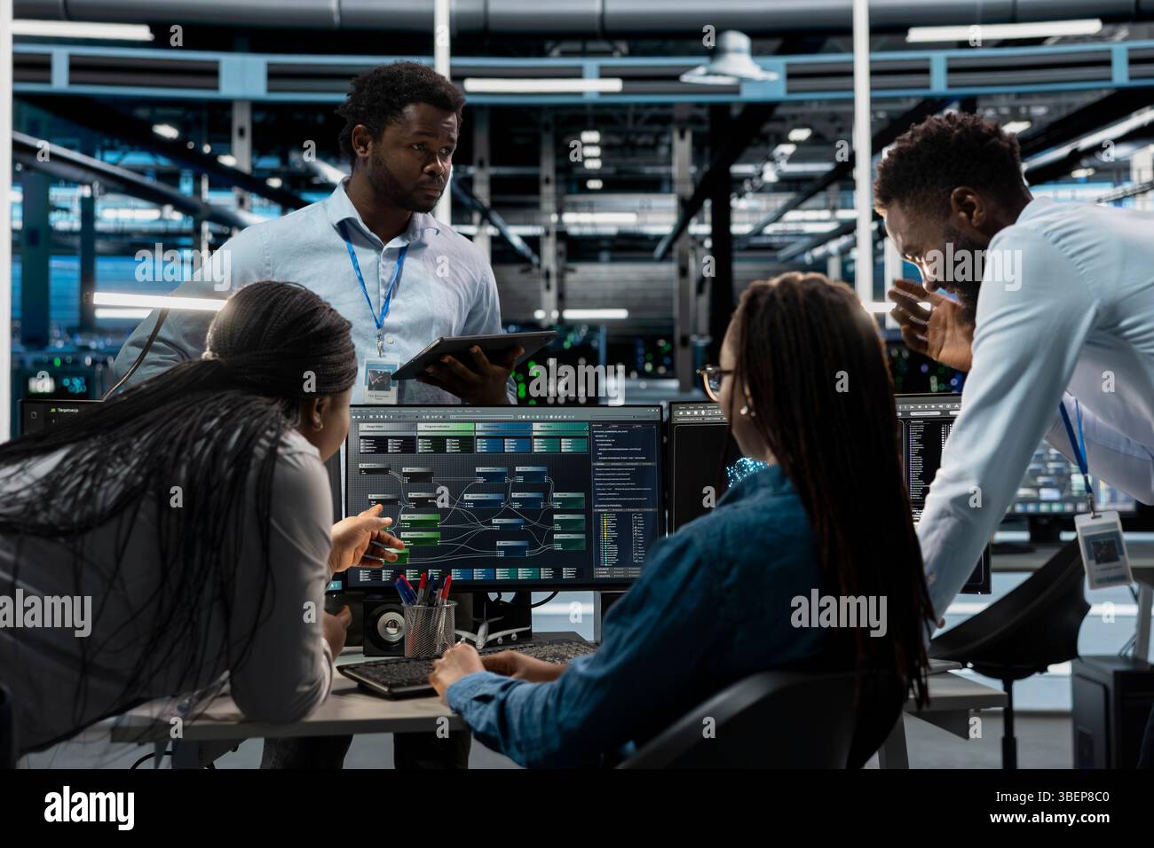 System administrators programming in AI data center housing advanced equipment used for machine learning training. Server hub employees run code on PC to upgrade artificial intelligence systems Stock Photo
