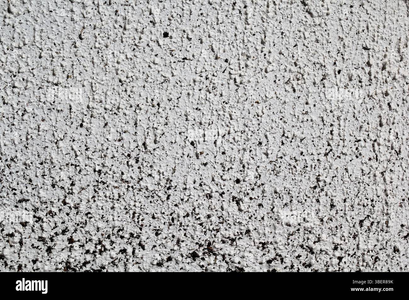White coarse concrete stucco wall abstract textured background Stock Photo