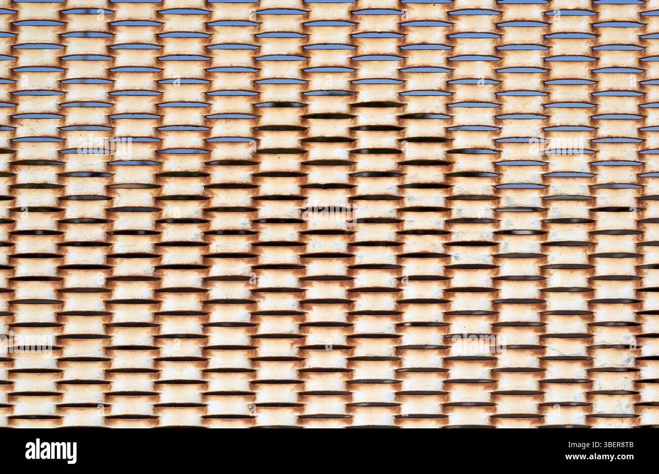 Weathered rusty expanded metal mesh abstract texture background Stock Photo