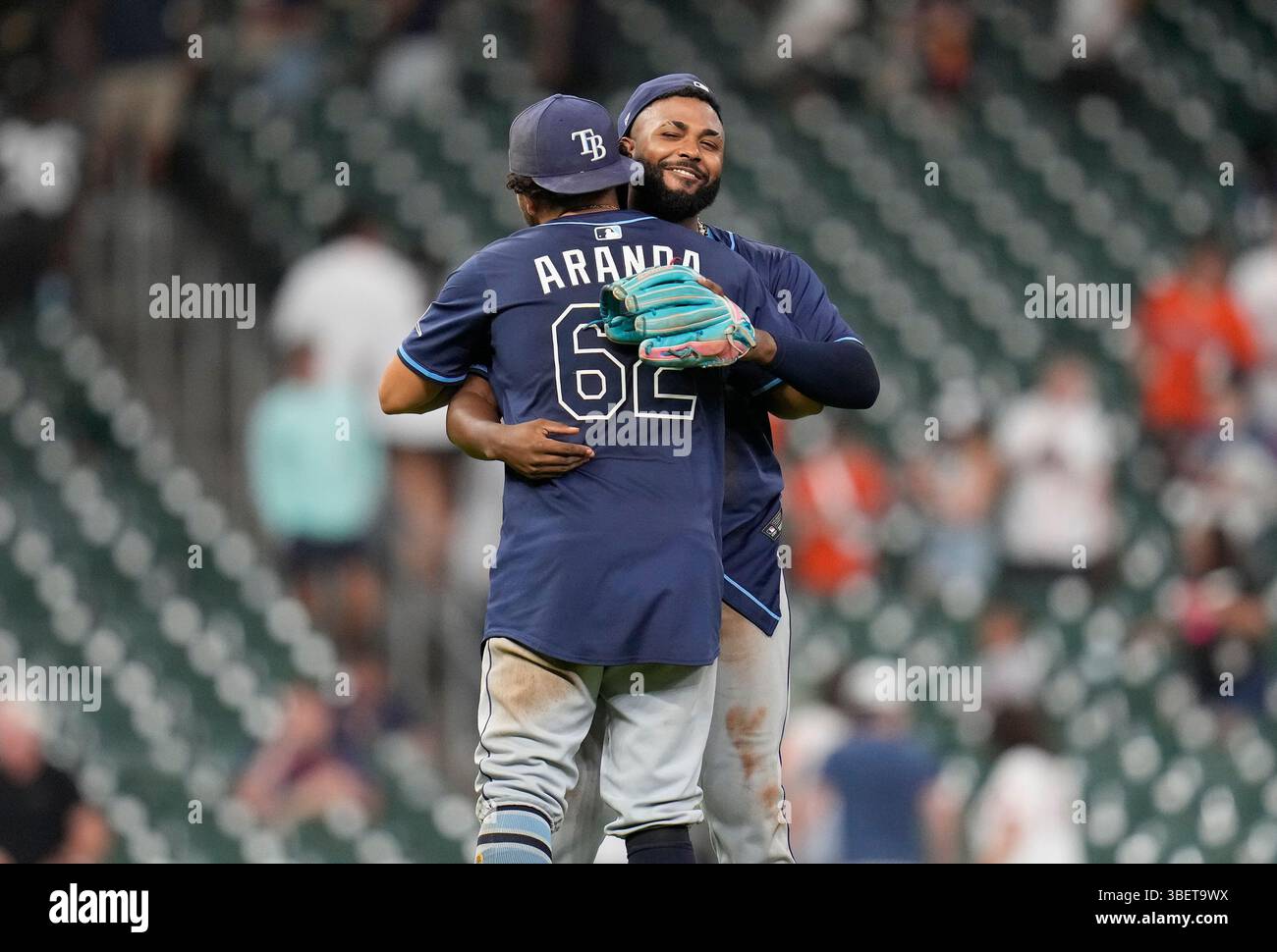 Tampa Bay Rays' Jonathan Aranda (62) hugs Junior Caminero, right, after ...