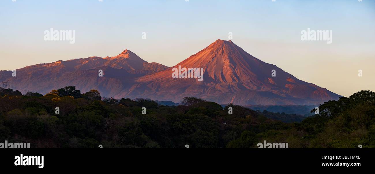 A breathtaking view of two majestic volcanoes in Colima, Mexico Stock ...