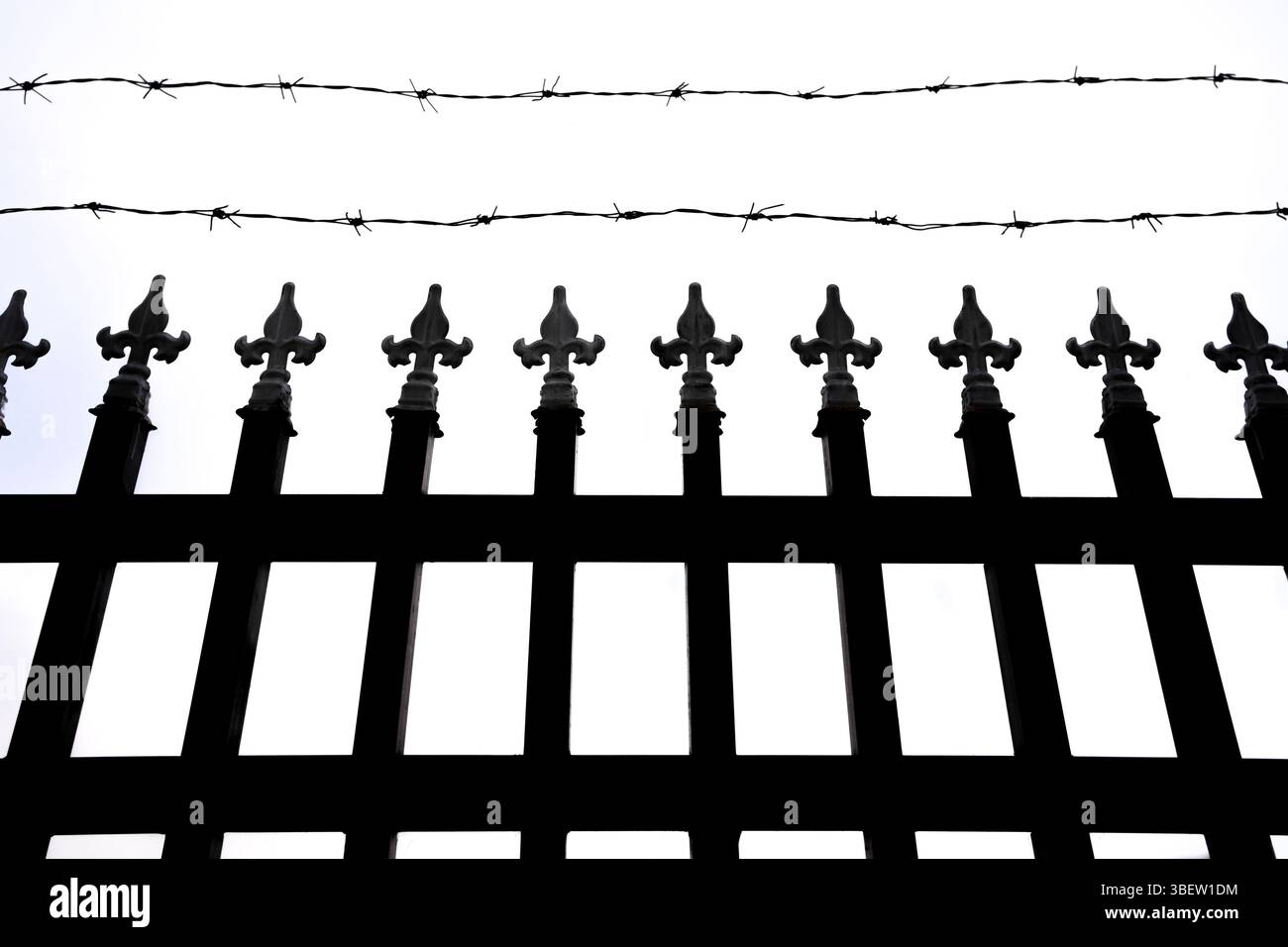 fence and barbed wire on white background Stock Photo