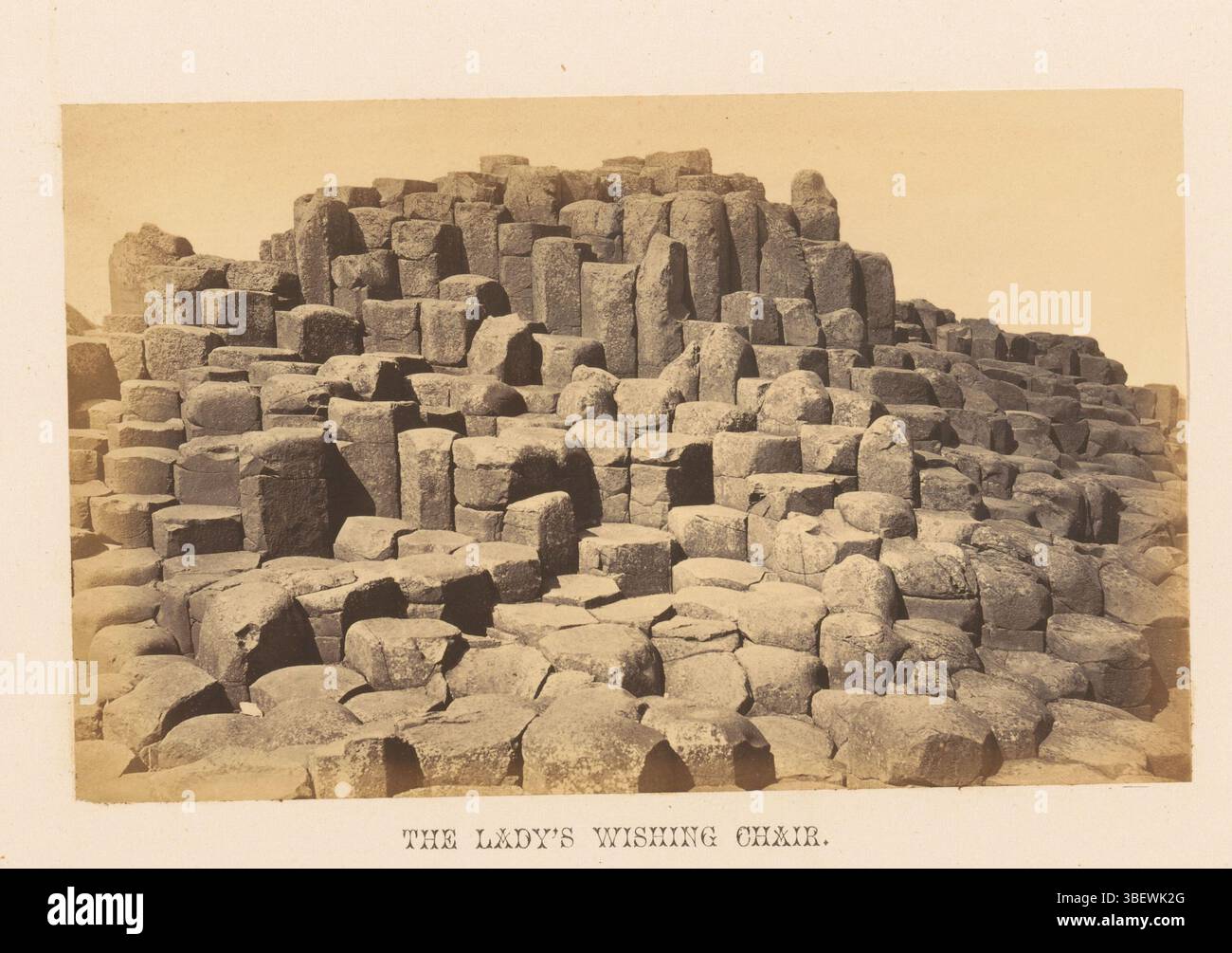 Giant's Causeway, Hudson, John, The Lady's Wishing Chair, View of rock formation the Lady's Wishing Chair, photograph, photo, page, photos, illustrated books, height 110 mm, width 178 mm, photographer, 1862 - 1867, photographic paper, photo paper, album print, albumin printing Stock Photo