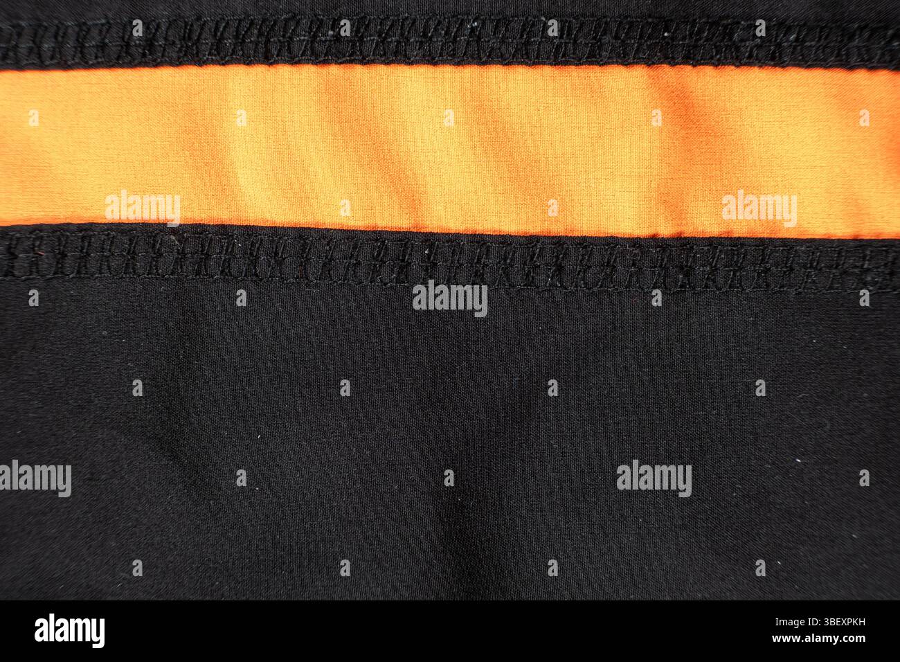 Old worn-out polyester and elastane fabric, pilling and frayed threads. Stock Photo