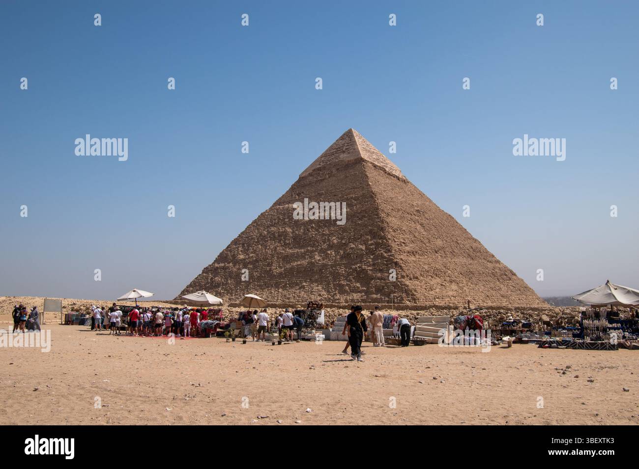 Tourists exploring the Giza Pyramid Complex archaeological site Stock ...