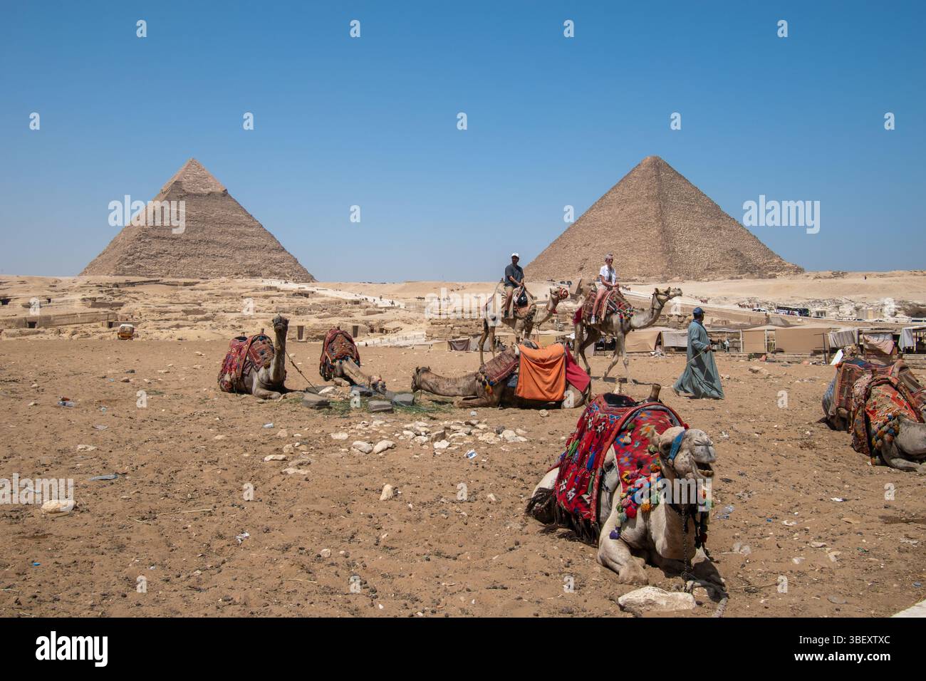 Tourists exploring the Giza Pyramid Complex archaeological site Stock ...
