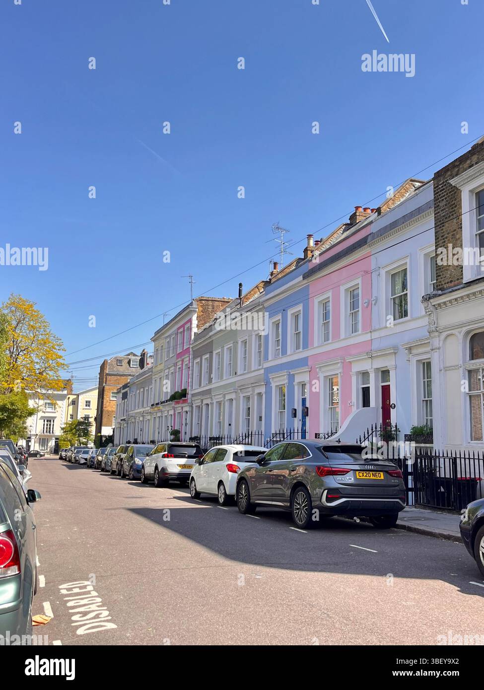 The iconic pastel coloured buildings and aesthetic streets of Notting Hill, London City, England, United Kingdom, Europe on a sunny day in Spring. - Smartphone Captured Stock Image