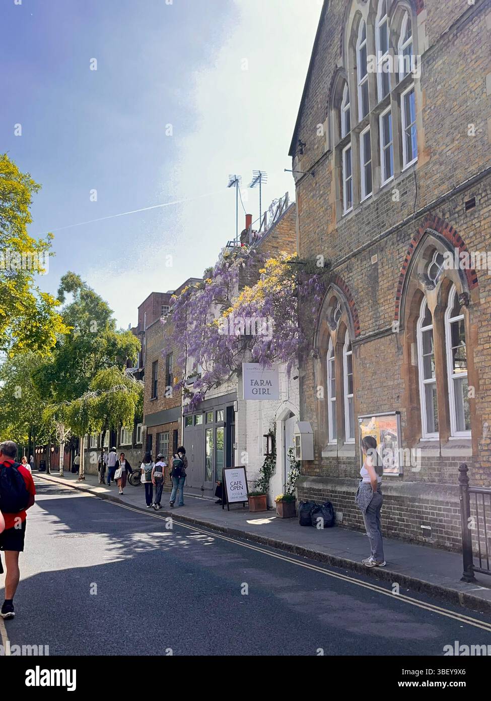 Tourists enjoying an iconic and aesthetic cafe in Notting Hill in London, England, United Kingdom, Europe on a sunny day in Spring. - Smartphone Captured Stock Image