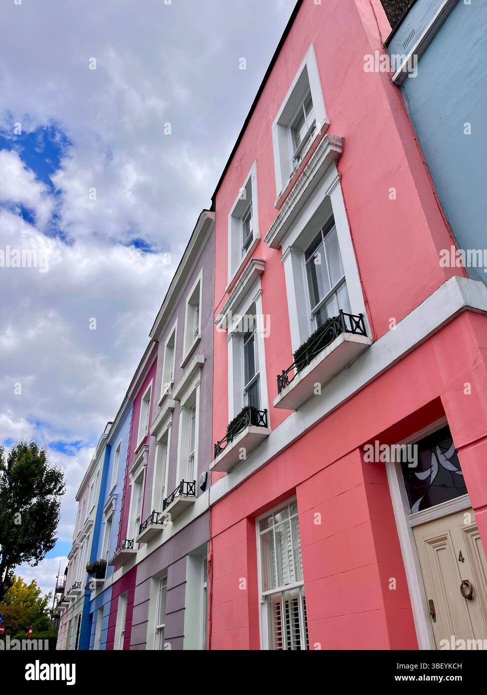 The aesthetic pastel coloured buildings in Kentish Town, London, England, United Kingdom, Europe on a sunny day in Spring of 2025. - Smartphone Captured Stock Image