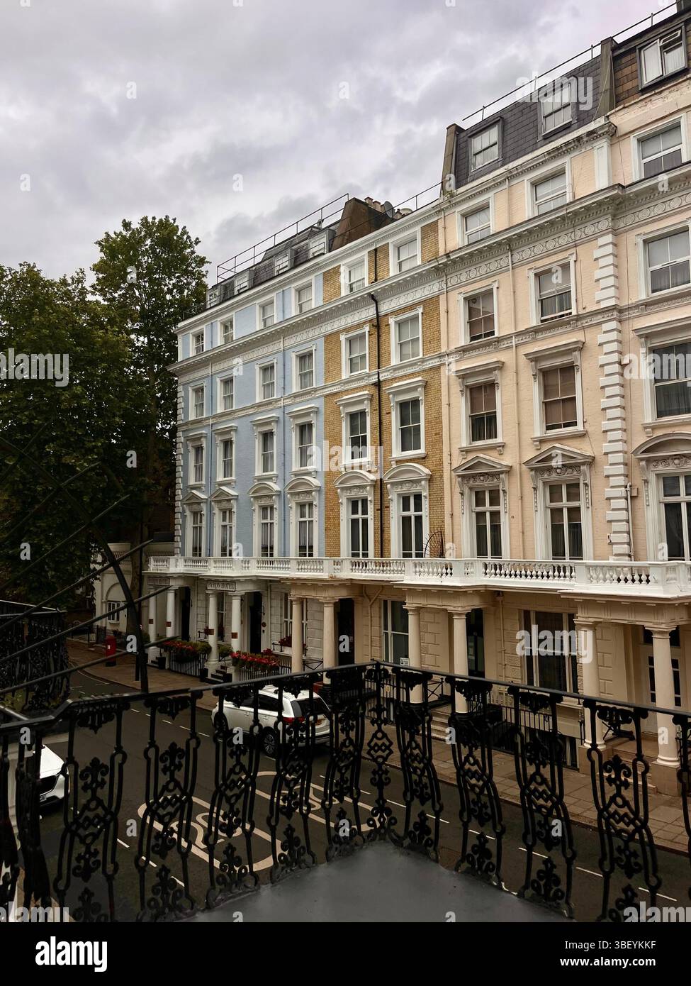 The beautiful pastel-colored townhouses on the streets of London in the heart of Kensington and Chelsea, London City, England, United Kingdom, Europe. - Smartphone Captured Stock Image