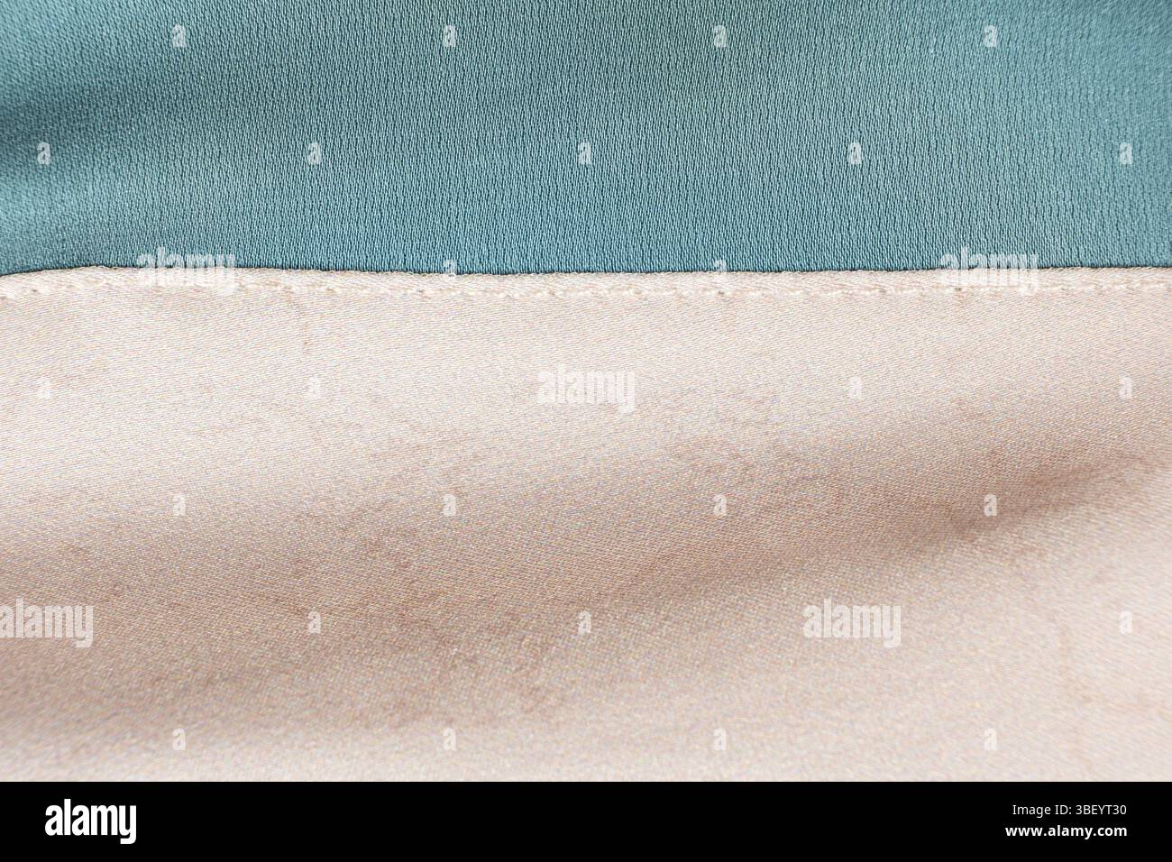 Polyester fabric with a little elastane, macro texture top view. Stitching with threads. Stock Photo