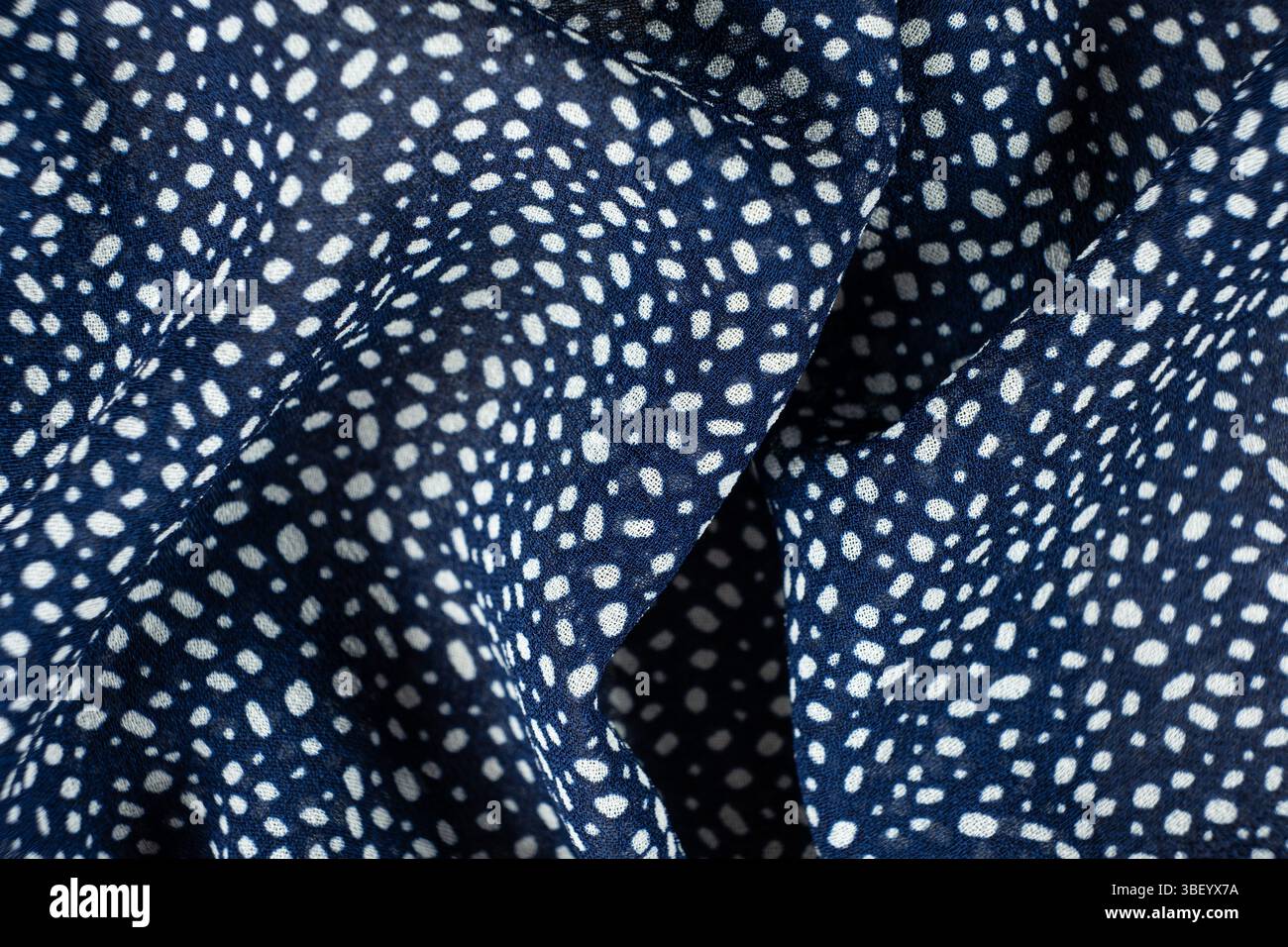 Macro Texture Polyester Blue Fabric Polka Dot Pattern. Stock Photo