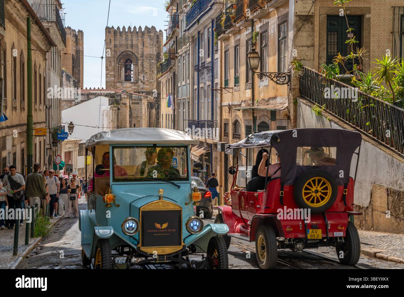 View of Tuk Tuks and Lisbon Cathedral in Alfama, Alfama District, Lisbon, Portugal, Europe Stock Photo