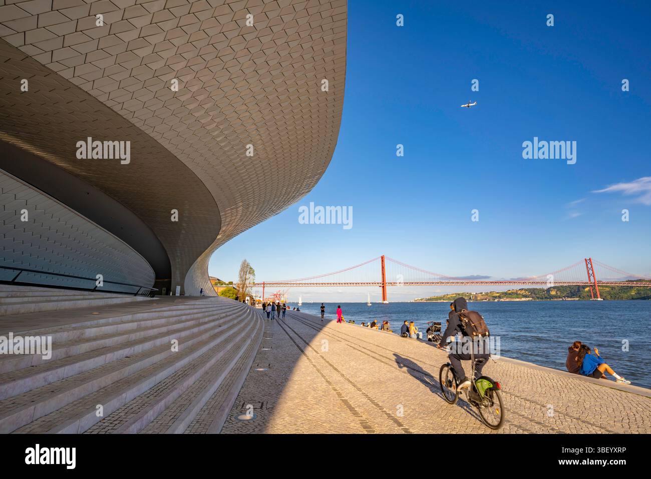 View of MAAT - Museum of Art, Architecture and Technology and 25 April Bridge on a sunny day, Lisbon, Portugal, Europe Stock Photo