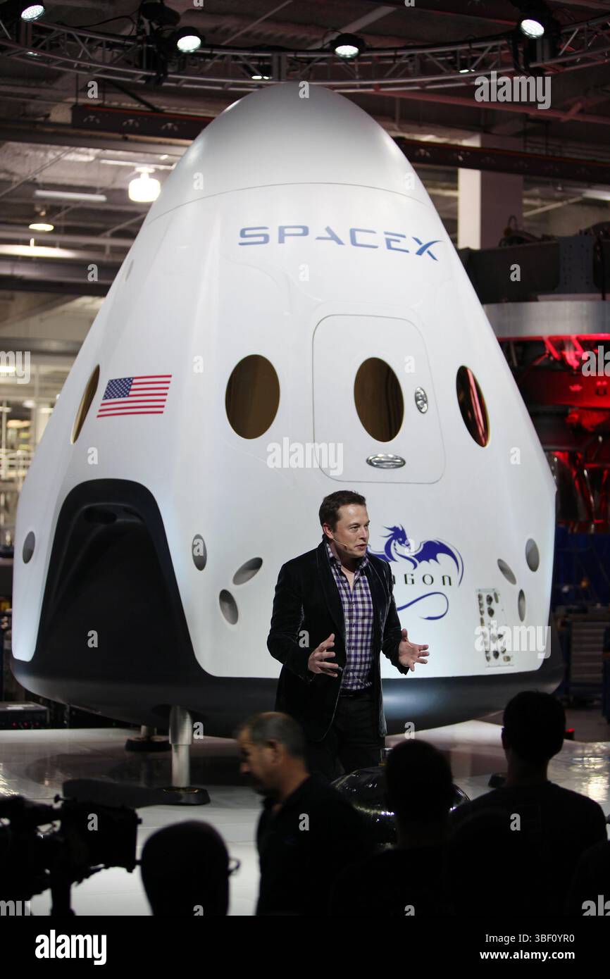 SpaceX CEO and founder Elon Musk unveils the Dragon V2 during a ceremony for the new spacecraft inside SpaceX headquarters in Hawthorne, California, 2014 - photo by NASA, Dimitri Gerondidakis Stock Photo