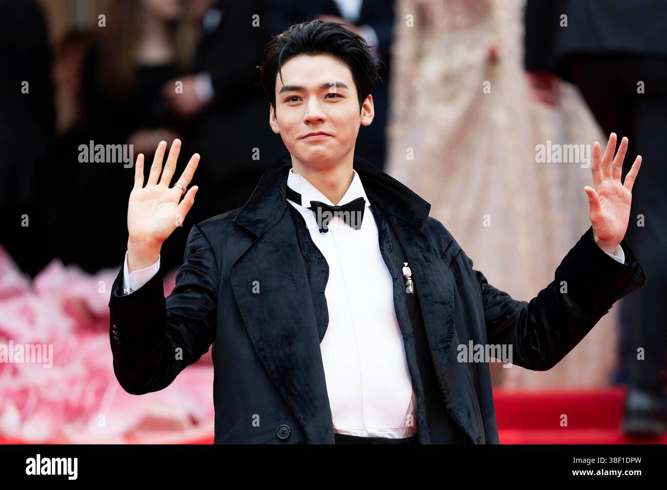 Gong Jun poses for photographers during the opening ceremony red carpet ...