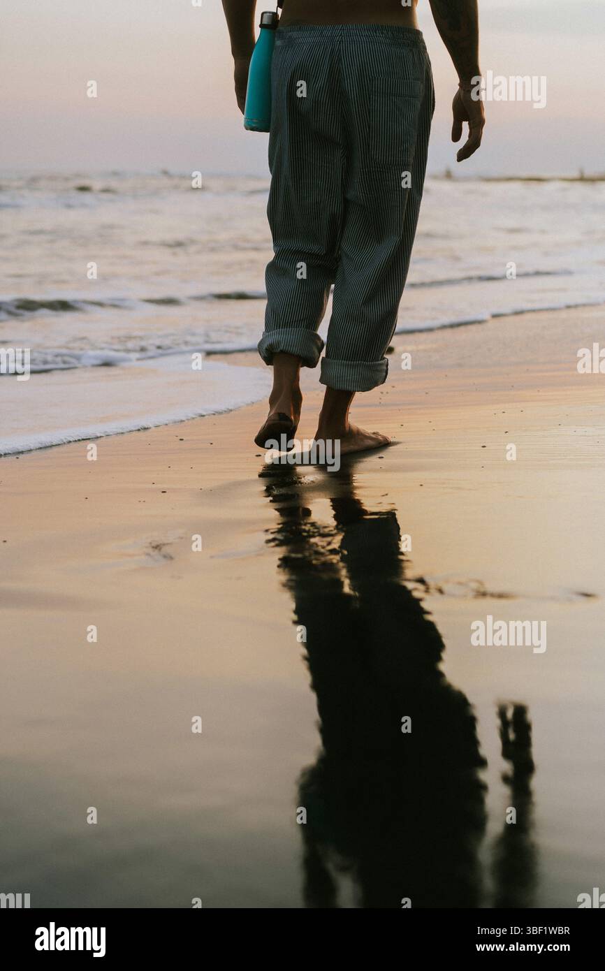 Man's footprints in the sand Stock Photo - Alamy