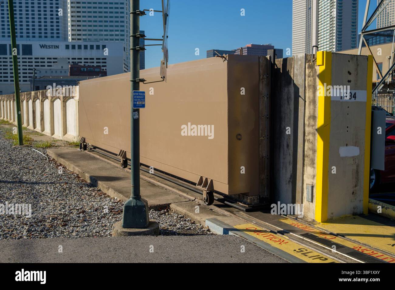 A floodgate is being closed to protect the city from rising water ...