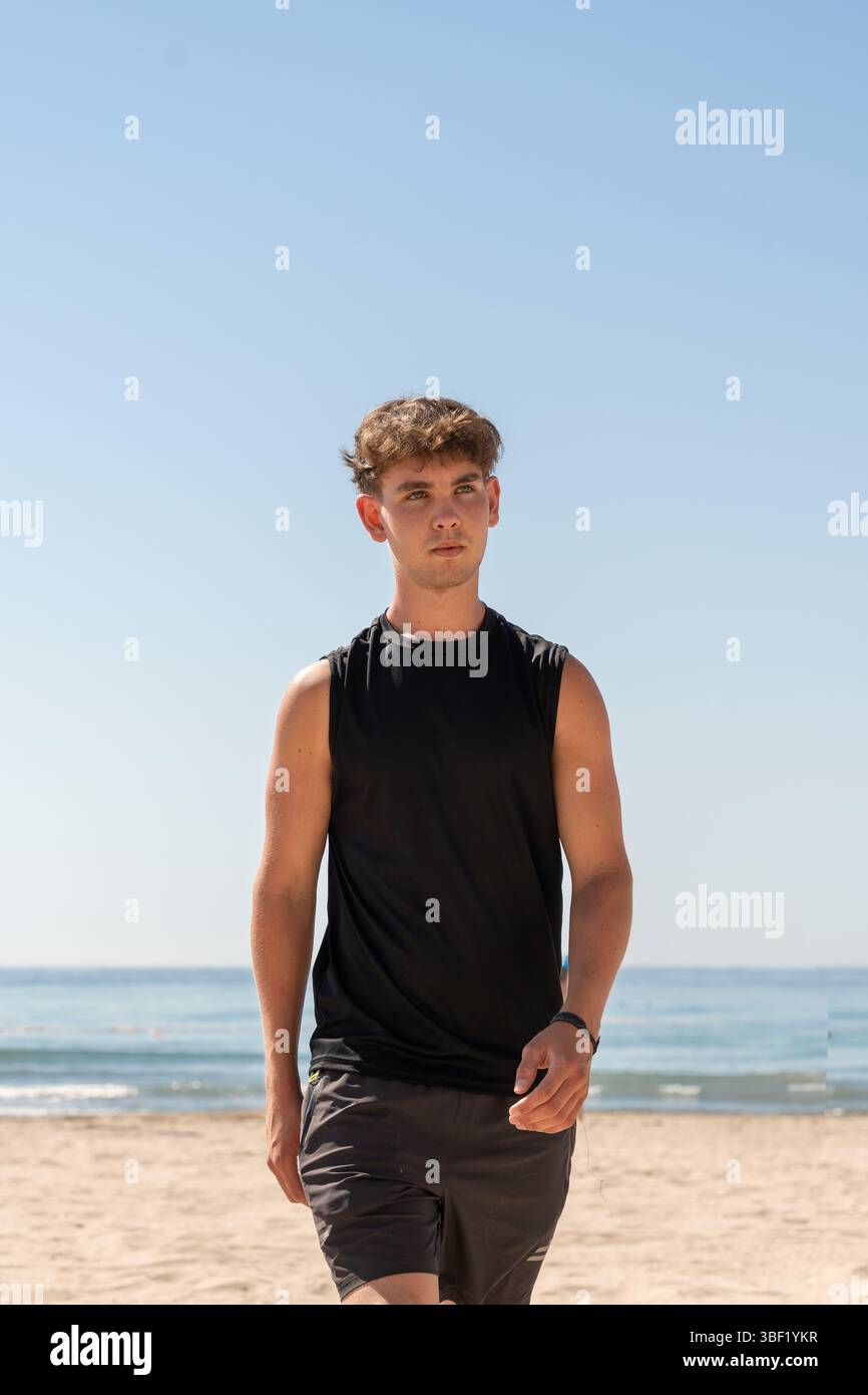 Young man walks along top hi-res stock photography and images - Alamy