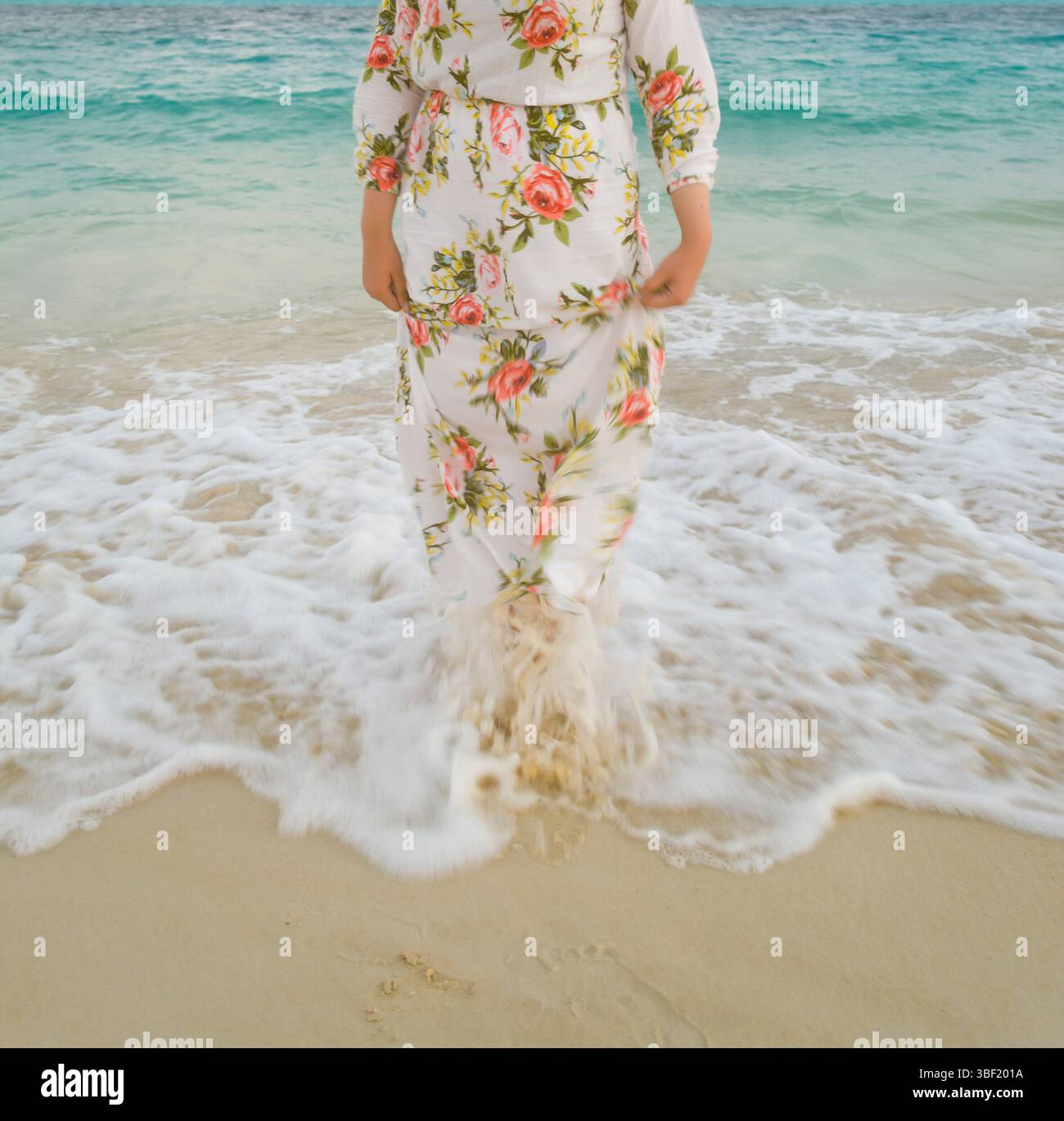 Woman in dress wading in water hi-res stock photography and images - Alamy