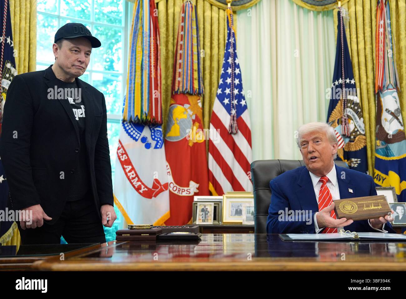 Trump Box On Rear End President Donald Trump speaks as he holds a box containing a key before ...