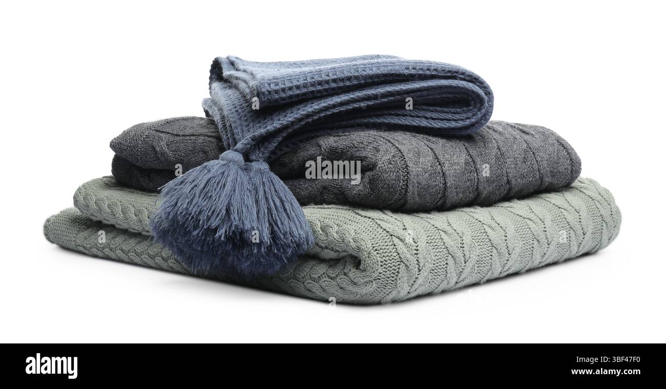 Stack of folded blankets isolated on white Stock Photo
