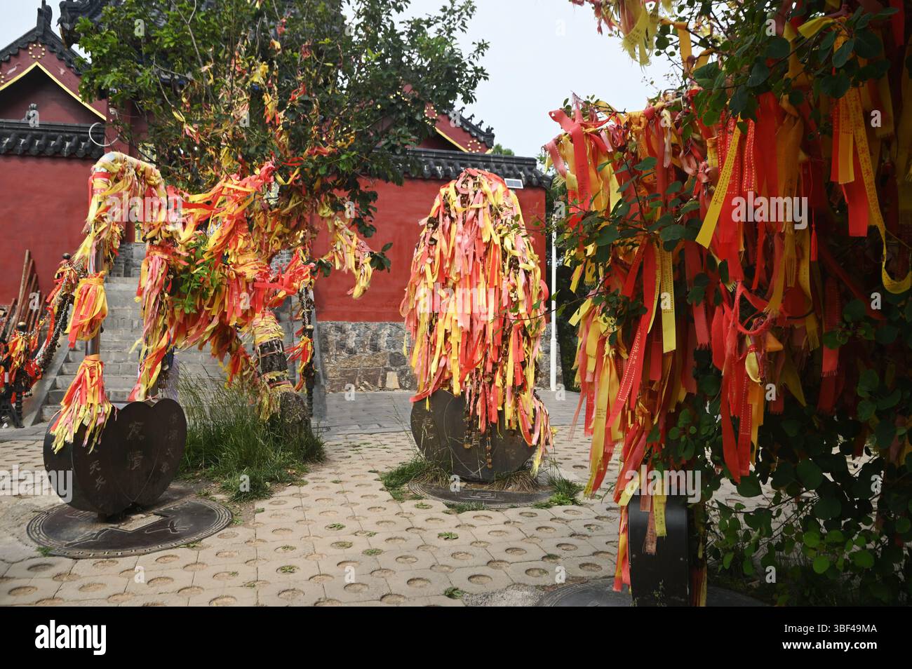 Taoist Ritual Ropes Red ribbons or cloth talismans tied to pillars in Taoist temples at ...
