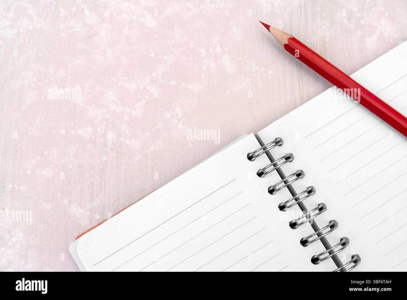 Red pencil and notebook for notes Stock Photo