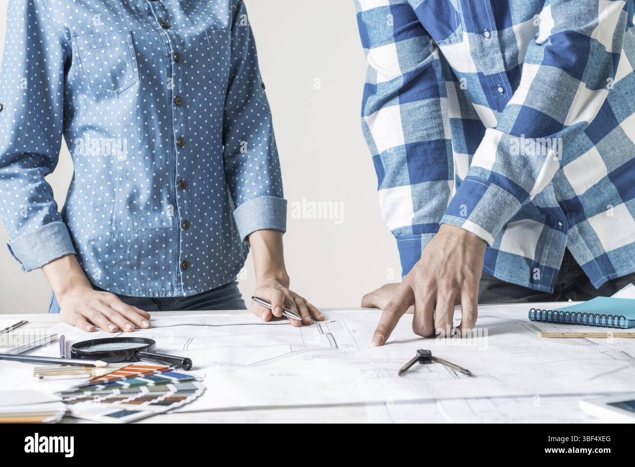 Working Design Men Man and woman together working at design project. Creative teamwork at ...