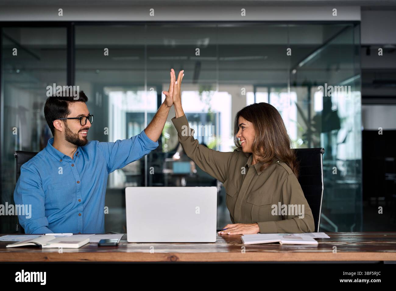Happy business team two employees give high five celebrate professional ...