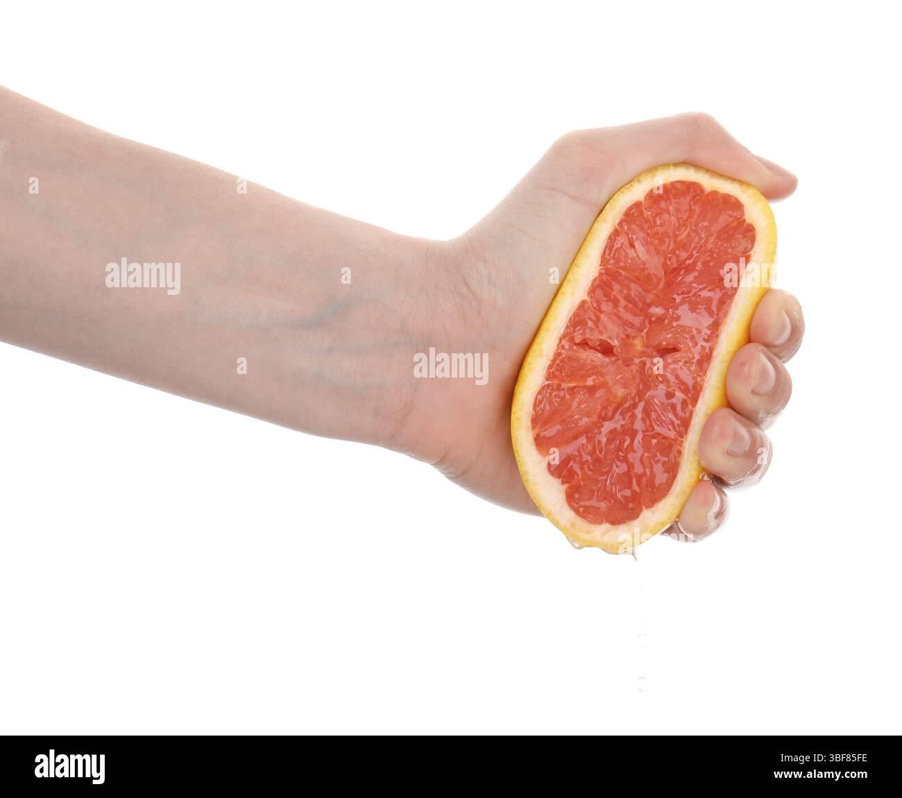 Woman squeezing grapefruit on white background, closeup Stock Photo