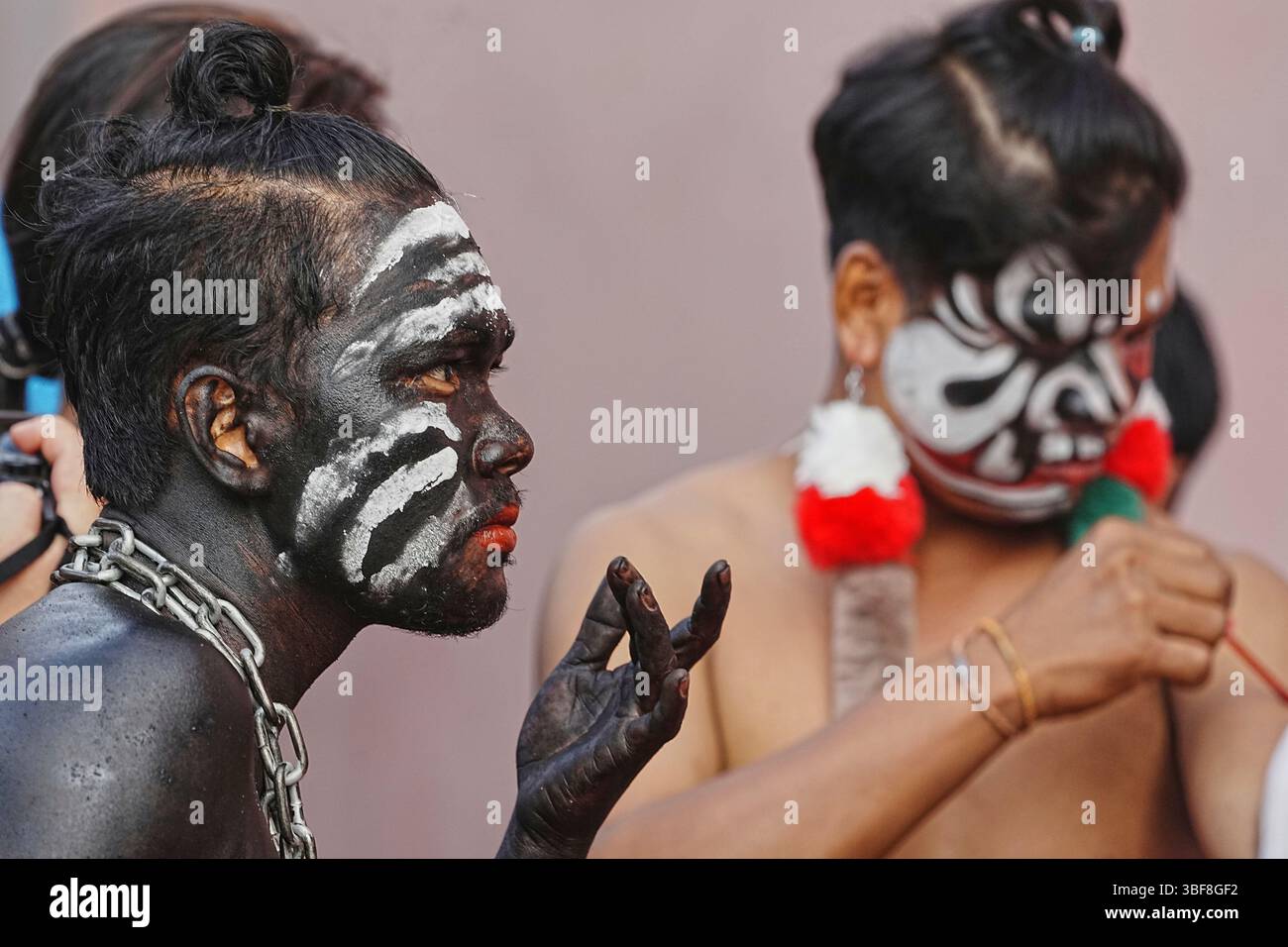 Neak Men Local men with their faces painted during a traditional guardian spirit ...