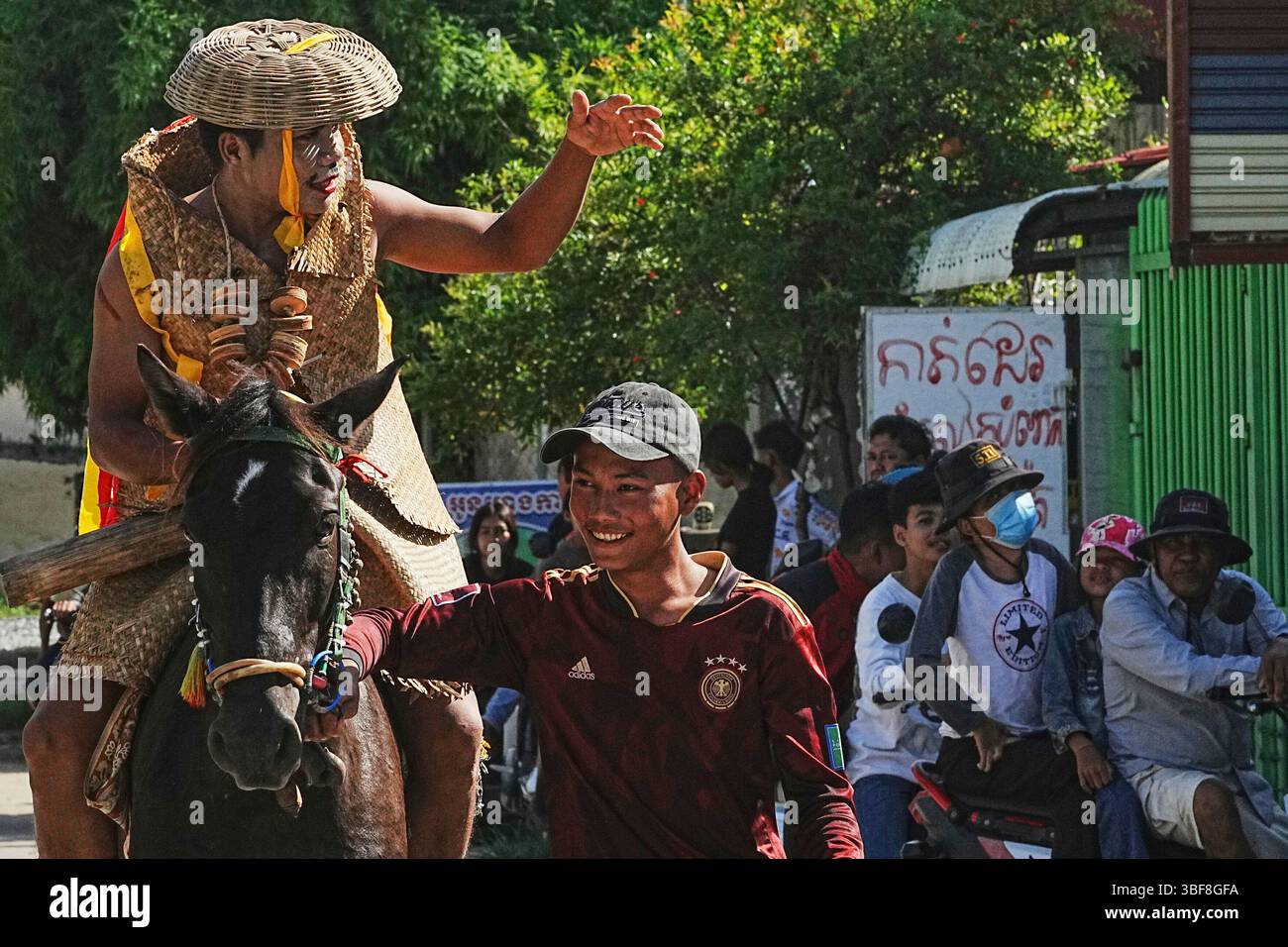 Neak Men A man, left, rides on a horse during a traditional guardian spirit ...