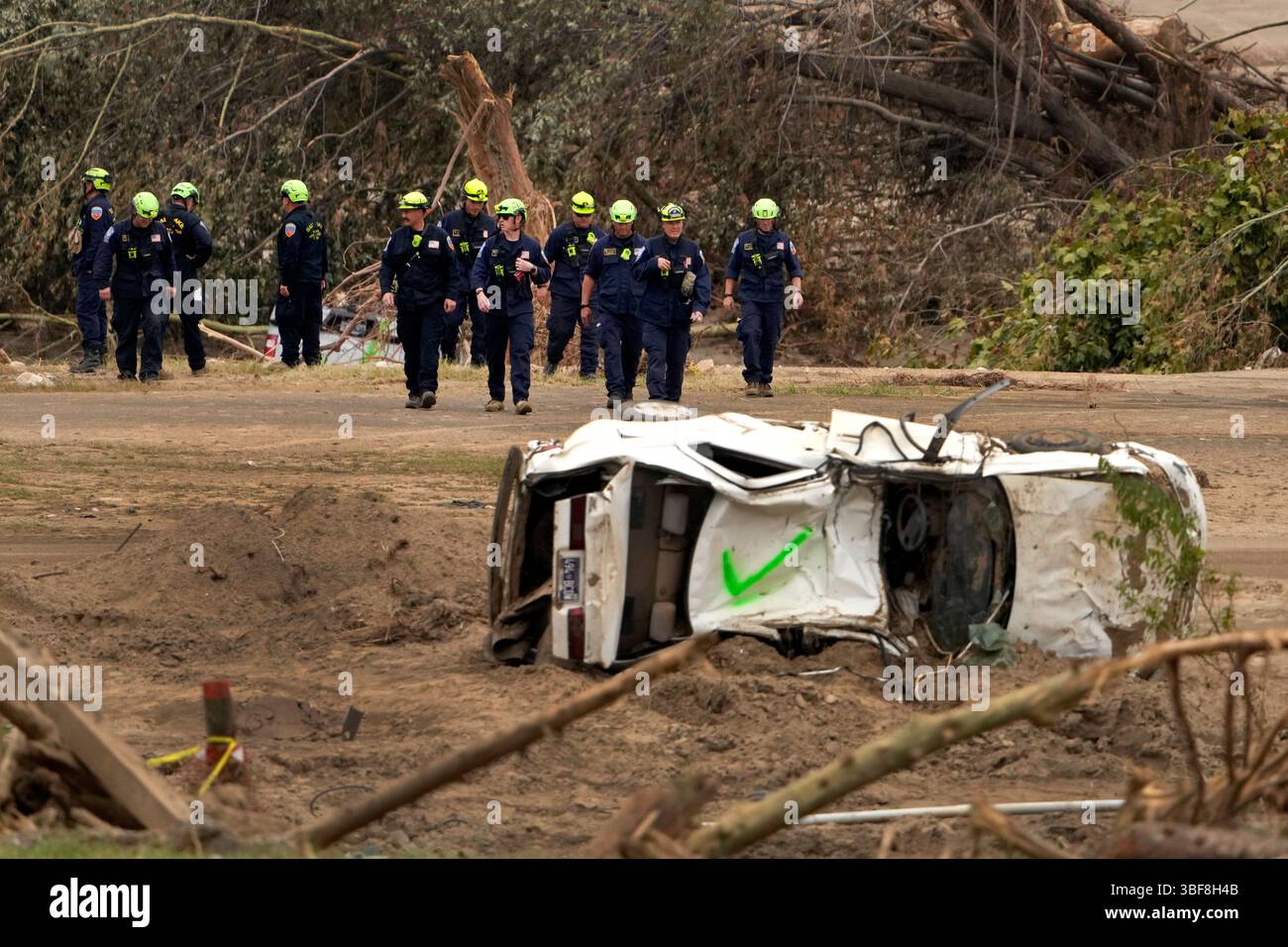 FILE - Personnel from Urban Search and Rescue Utah Task Force 1 work in ...