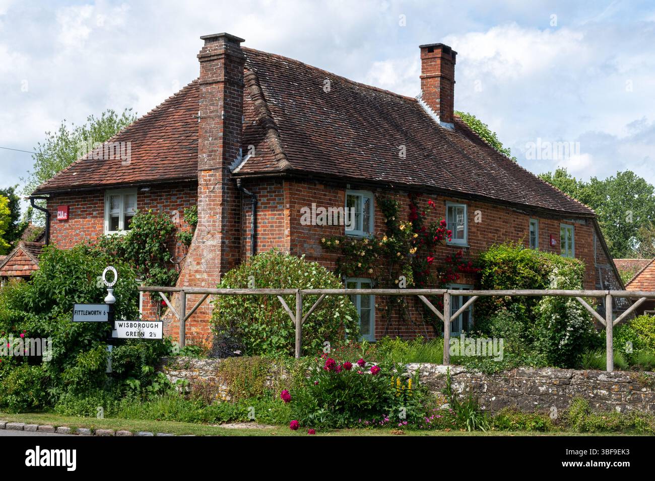View of attractive properties in Kirdford, a pretty village in West Sussex, England, UK, during May. Stock Photo