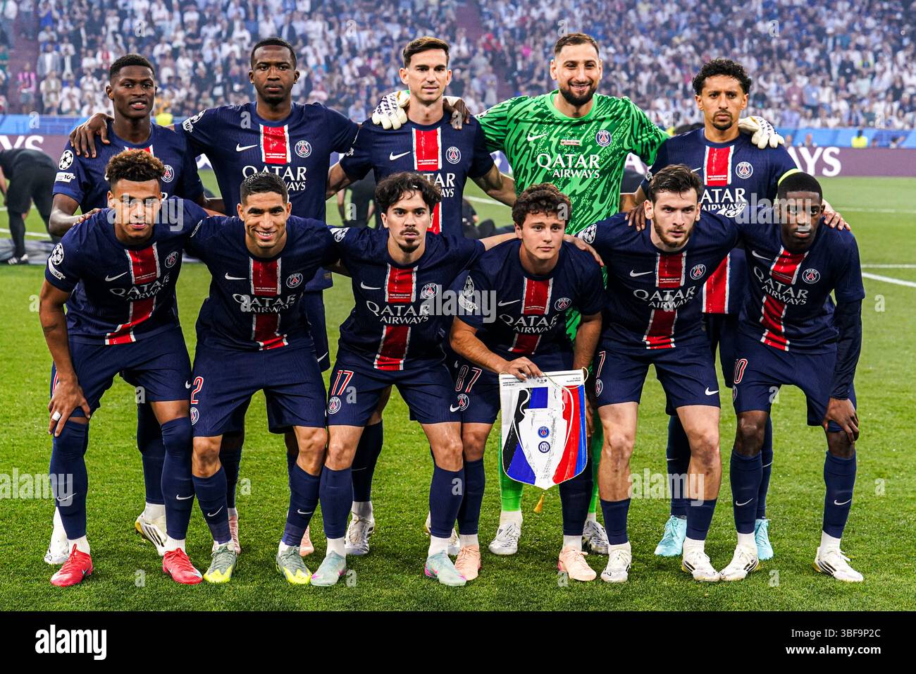 MUNICH, GERMANY - MAY 31: goalkeeper Gianluigi Donnarumma of Paris Saint-Germain, Nuno Mendes of Paris Saint-Germain, Willian Pacho of Paris Saint-Germain, Marquinhos of Paris Saint-Germain, Achraf Hakimi of Paris Saint-Germain, Fabian Ruiz of Paris Saint-Germain, Vitinha of Paris Saint-Germain, Joao Neves of Paris Saint-Germain, Kvicha Kvaratskhelia of Paris Saint-Germain, Ousmane Dembele of Paris Saint-Germain, Desire Doue of Paris Saint-Germain posing for a team photo during the UEFA Champions League Final 2025 match between Paris Saint-Germain and FC Internazionale Milano at Munich Footbal Stock Photo