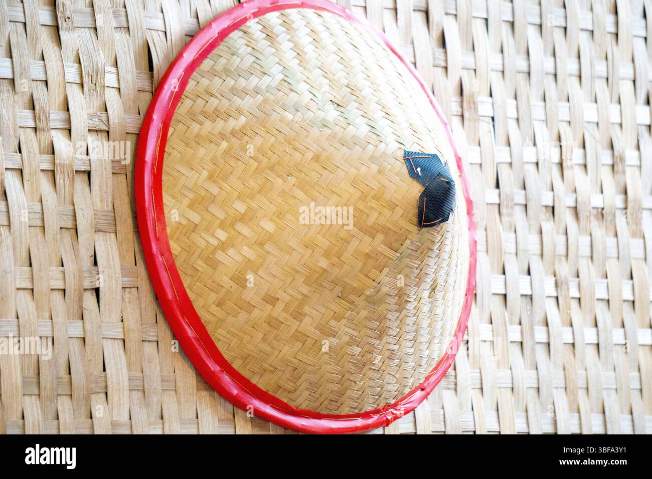 Capil, a traditional Indonesian hat made of woven bamboo. This hat is ...