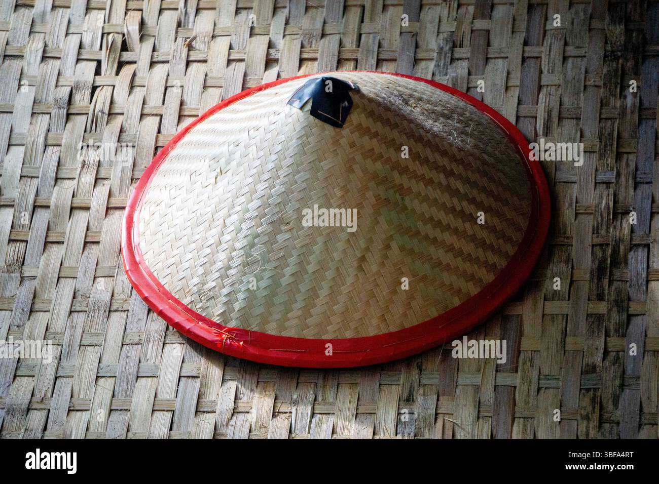 Capil, a traditional Indonesian hat made of woven bamboo. This hat is ...