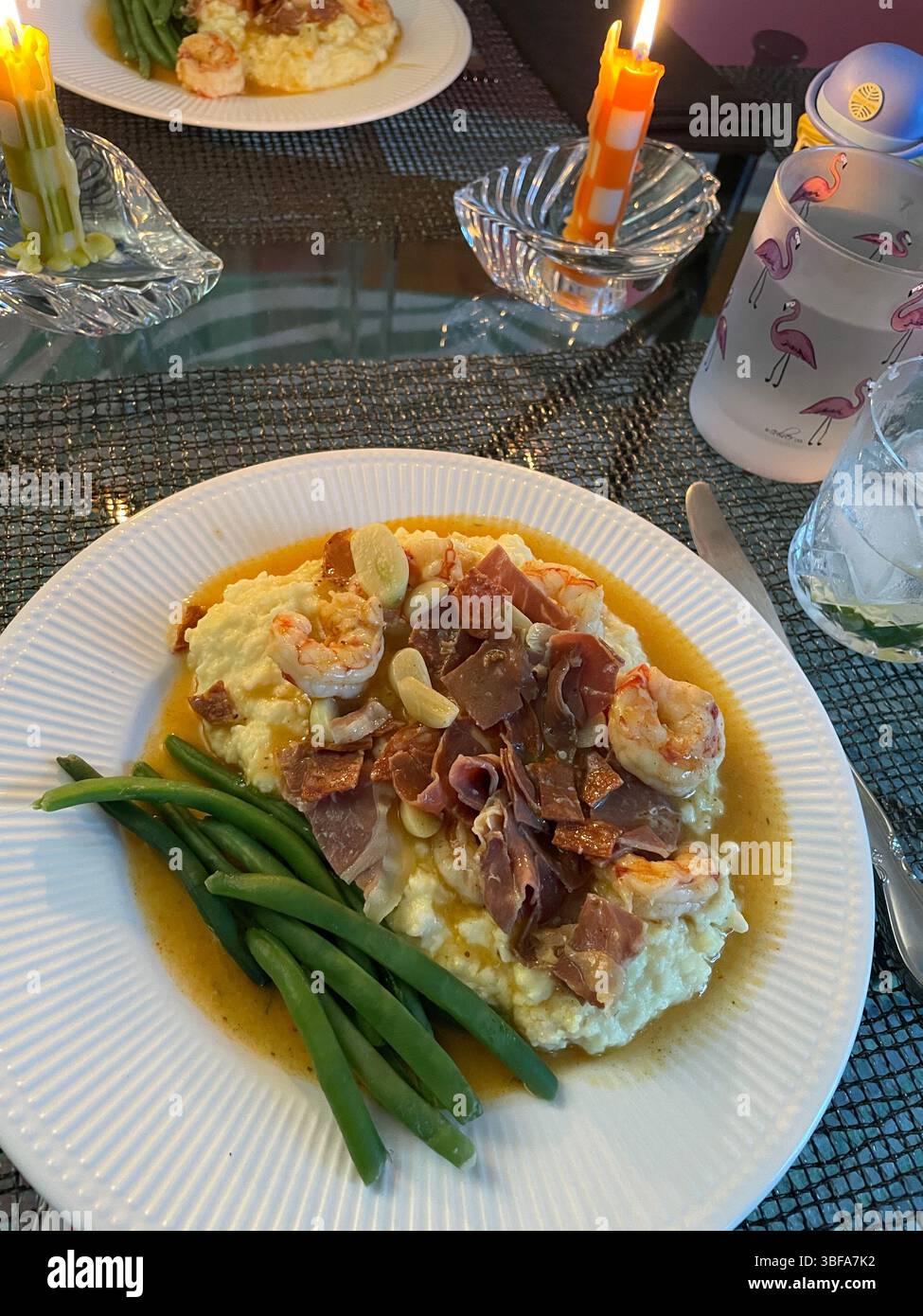 Shrimp and grits served on a White Plate, USA, 2025 - Smartphone Captured Stock Image