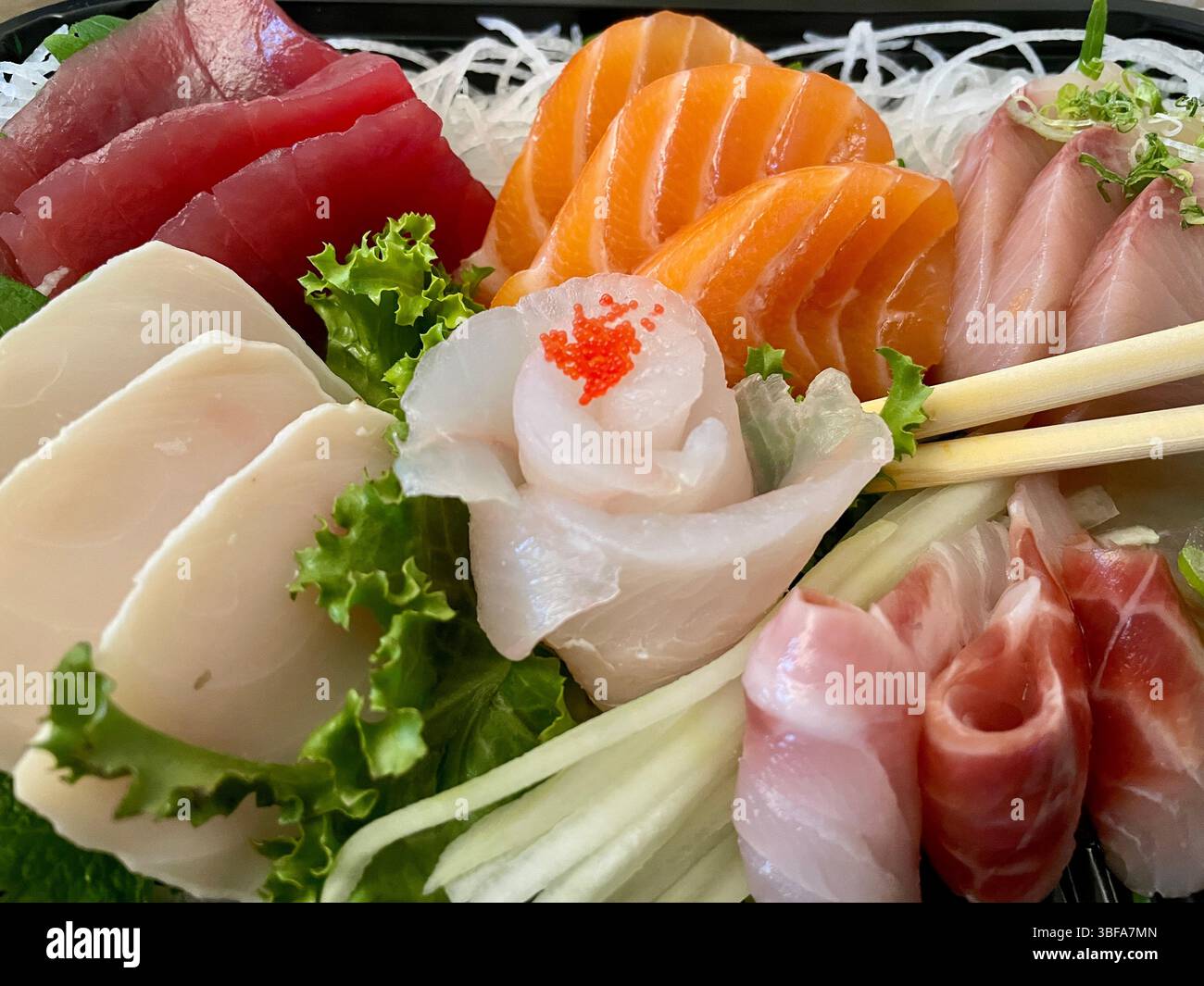 Close up of a Japanese meal of delivered fresh sashimi - Smartphone Captured Stock Image