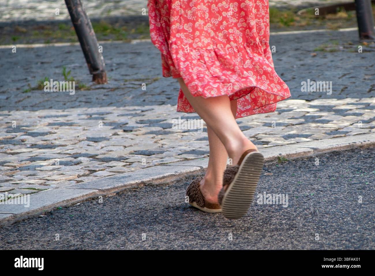 Woman walking barefoot street hi-res stock photography and images - Alamy